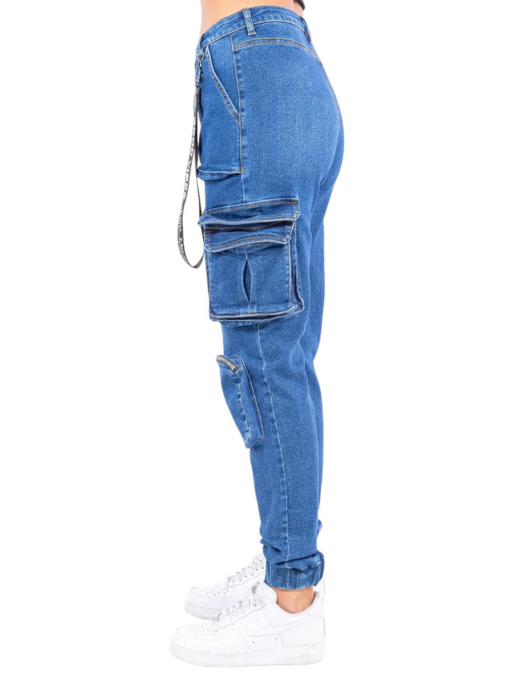 a woman wearing a pair of blue jeans with zippers