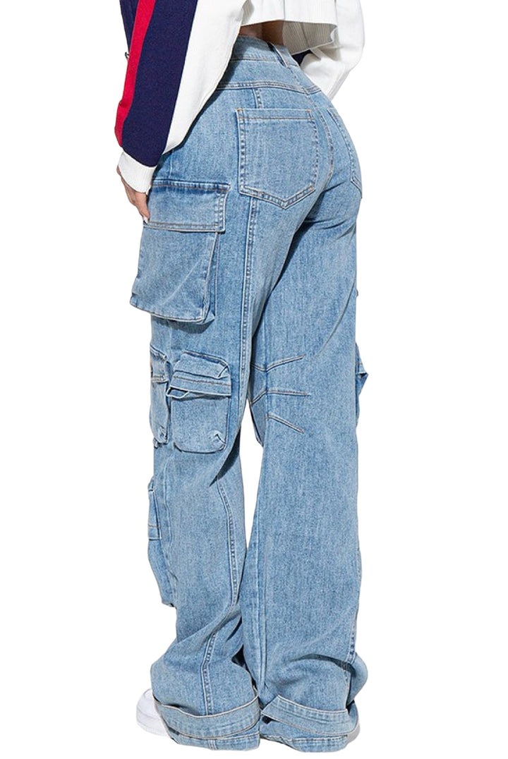a man in a white shirt and blue jeans