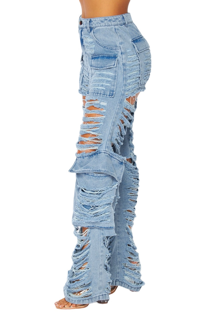 a woman wearing a pair of ripped jeans