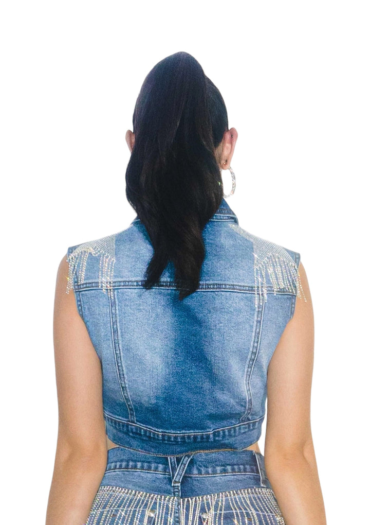 the back of a woman wearing a denim dress