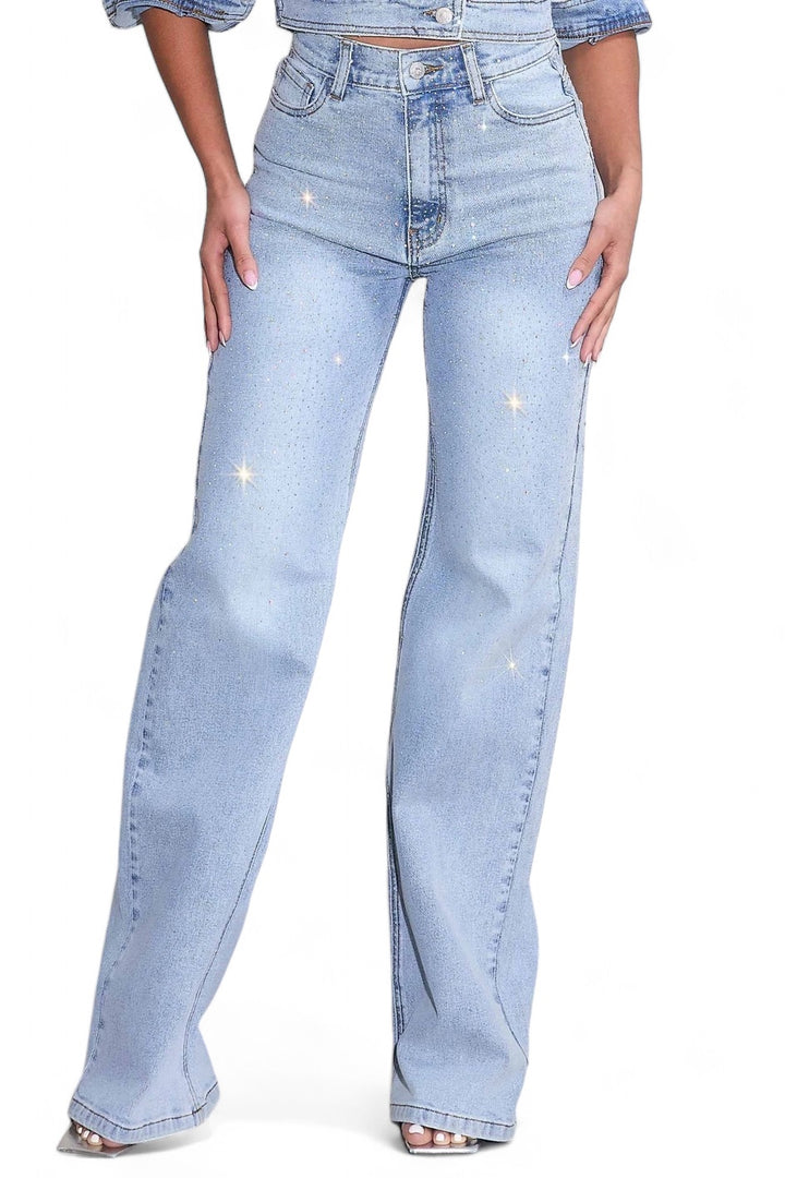 a woman wearing a pair of light blue jeans