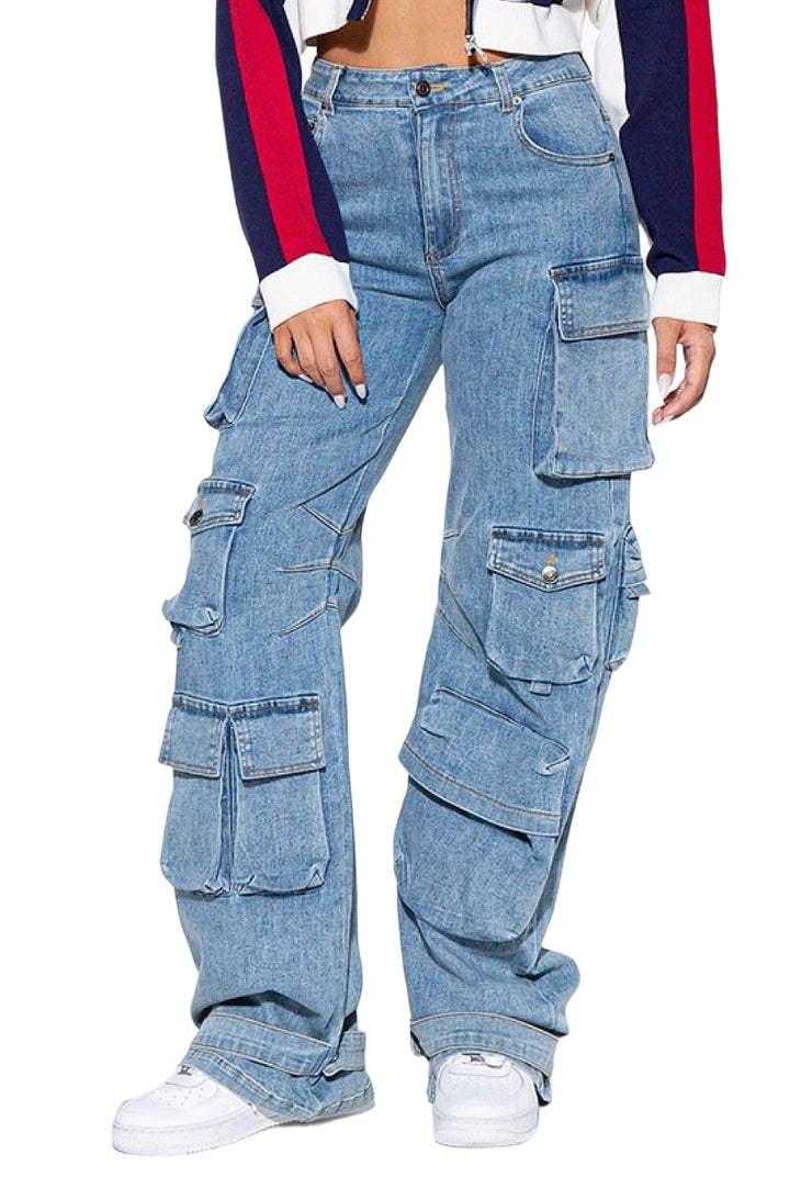 a woman in a white shirt and blue jeans