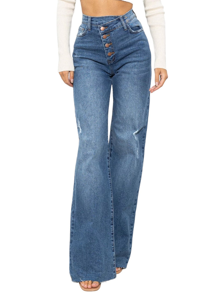 a woman in a white top and jeans