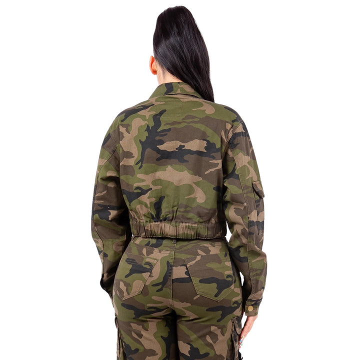 a woman in a camouflage print jumpsuit