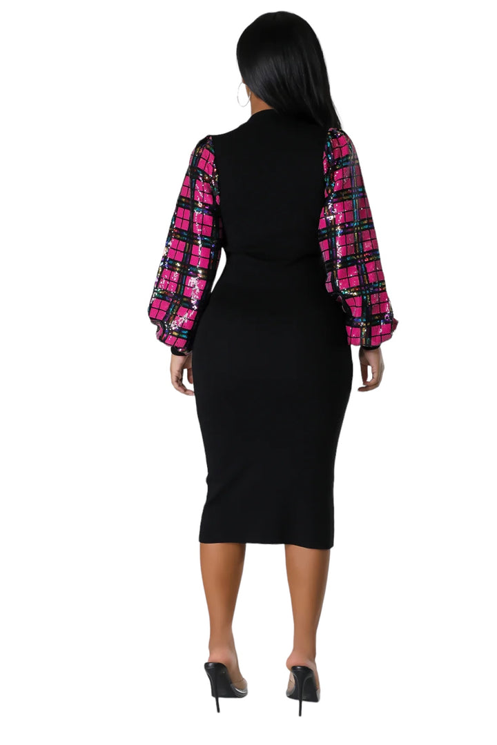 a woman in a black and pink dress