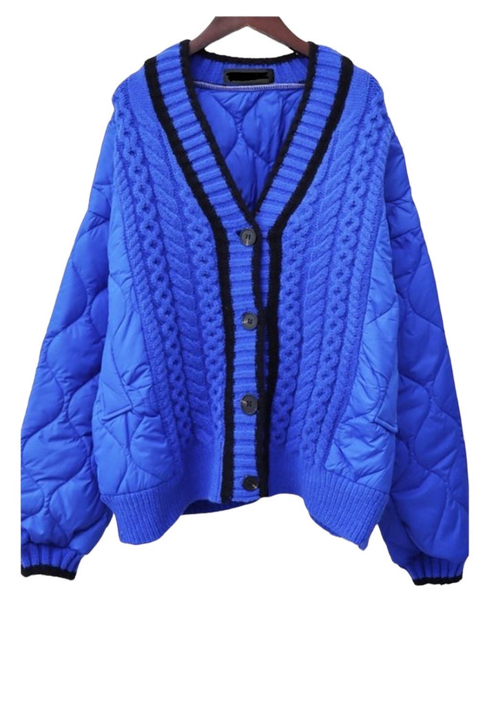 a blue jacket with black trims on a hanger