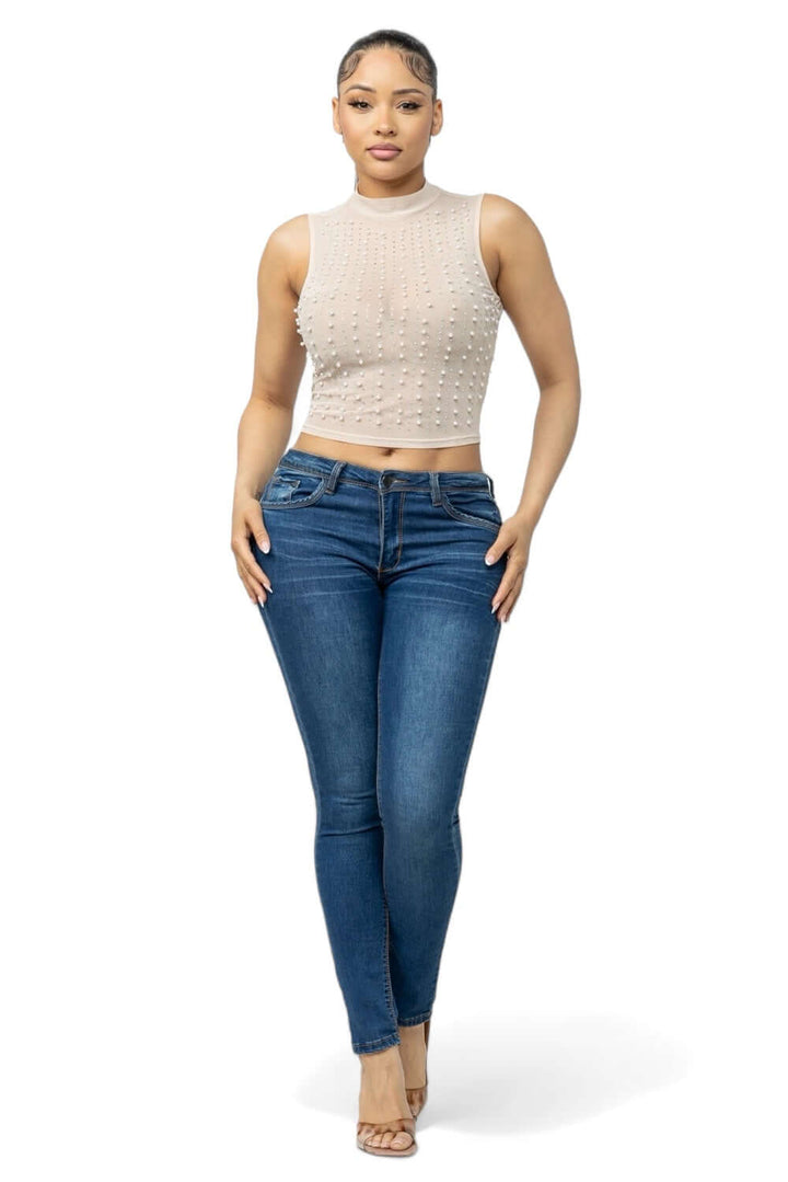 a woman in a crop top and jeans