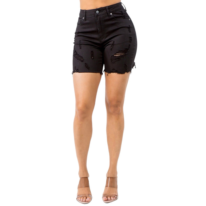 a woman wearing black shorts with holes on the side