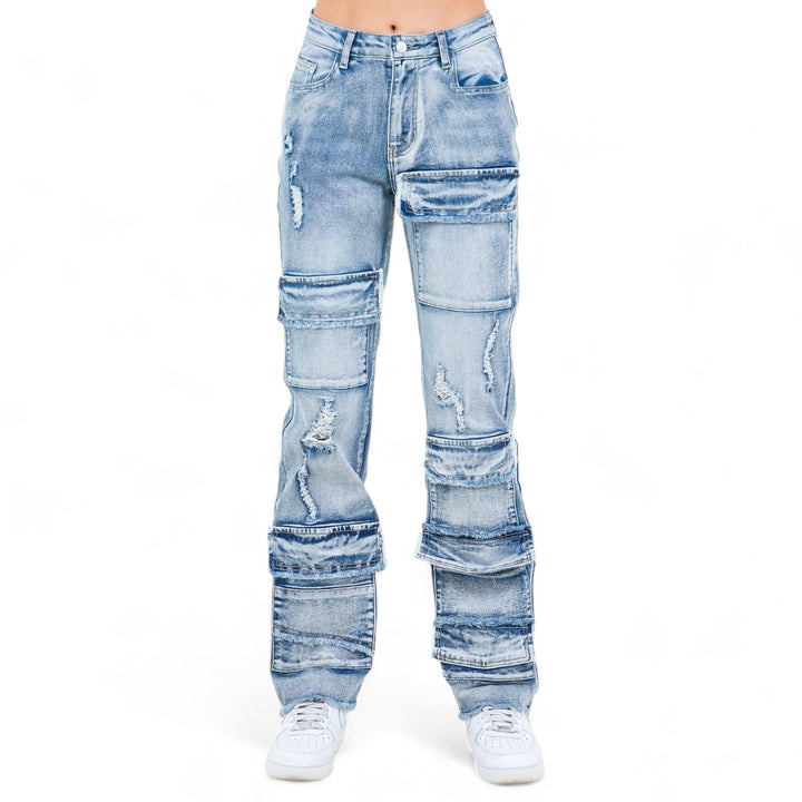 a woman wearing a pair of ripped jeans