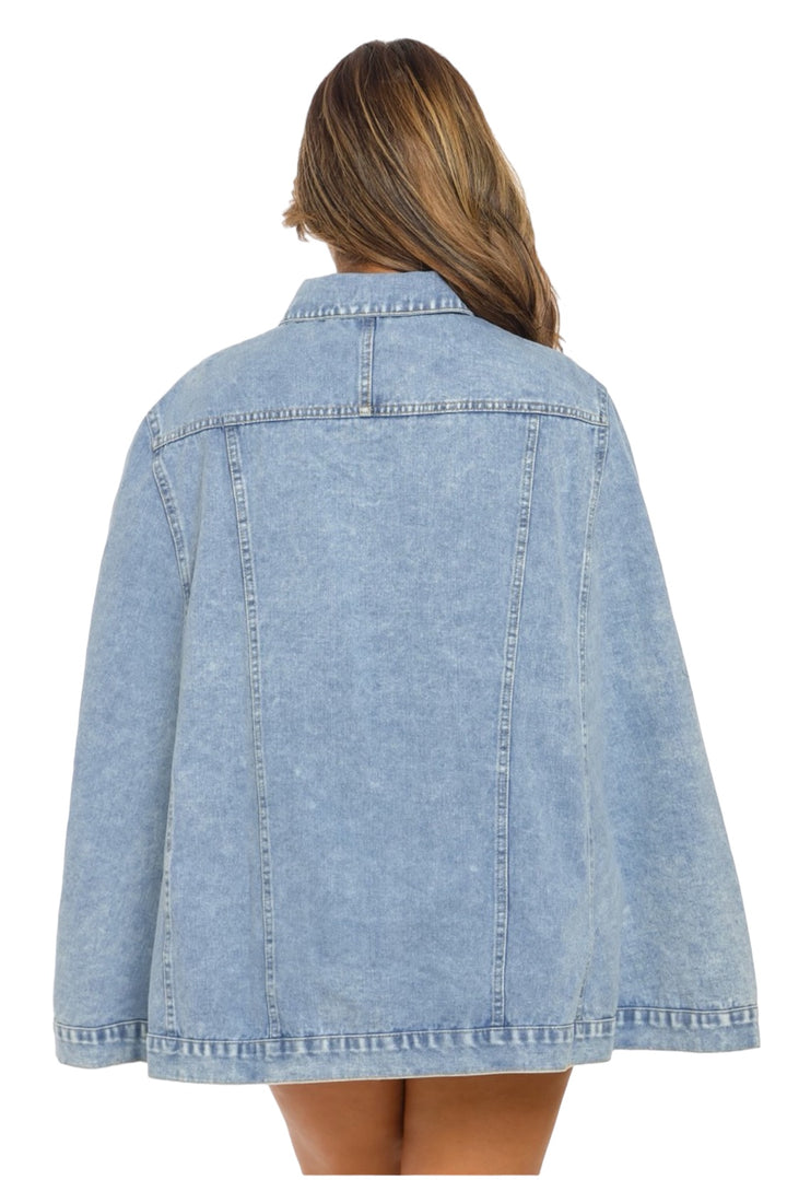 a woman wearing a jean jacket and panties