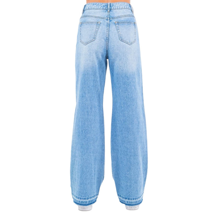 the back of a woman's jeans showing the back of her pants