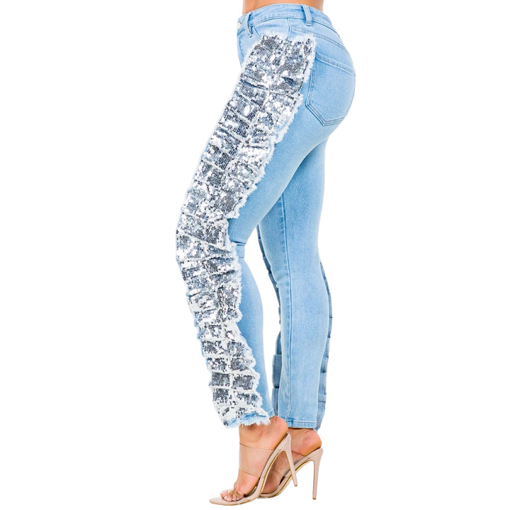 a woman wearing a pair of jeans with sequins on the side