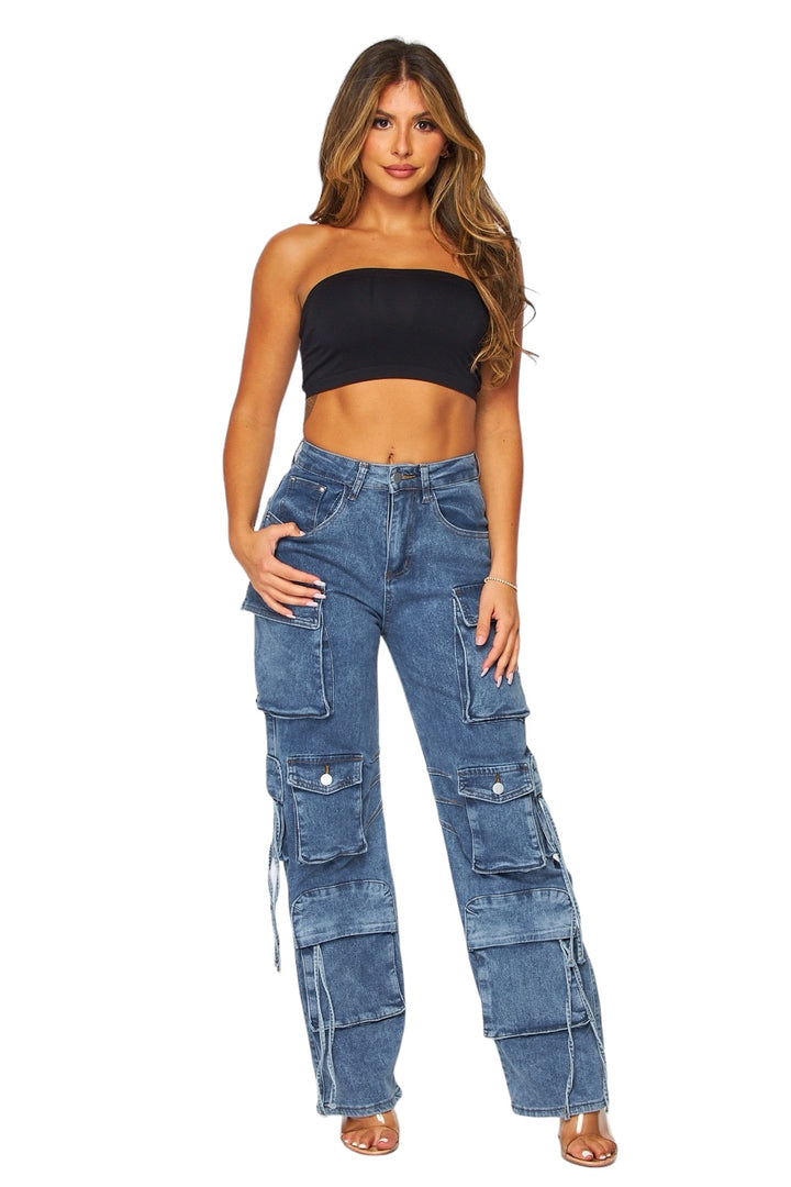a woman wearing a crop top and jeans
