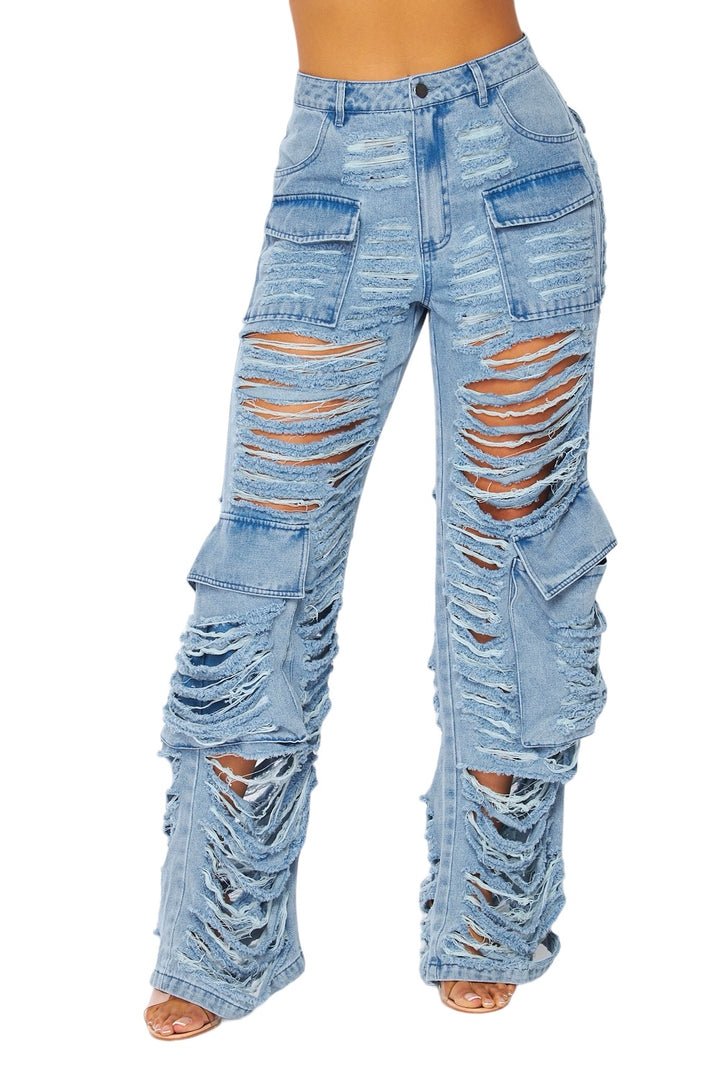 a woman wearing a pair of ripped jeans