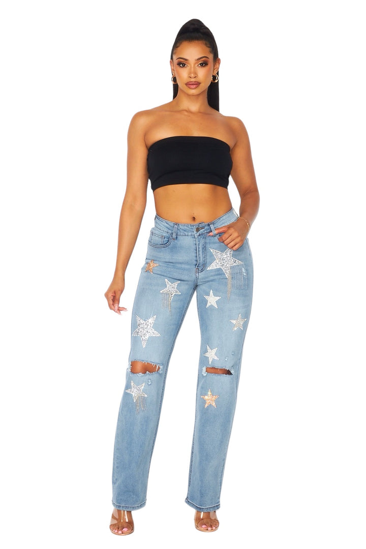 a woman wearing a crop top and jeans