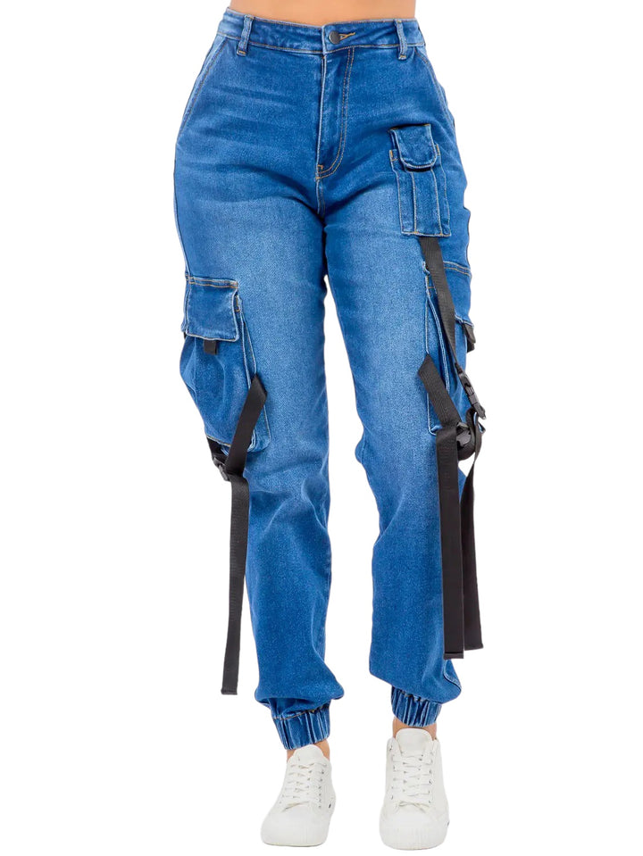 a woman wearing blue jeans and white sneakers