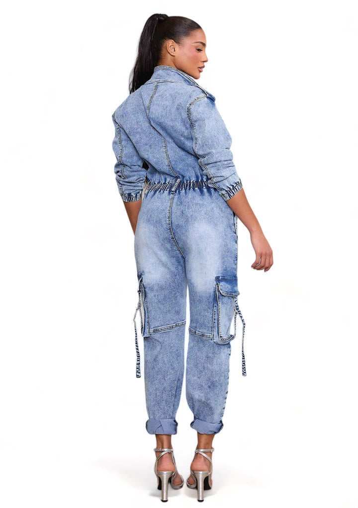 a woman wearing a jean jumpsuit with a denim jacket and heels