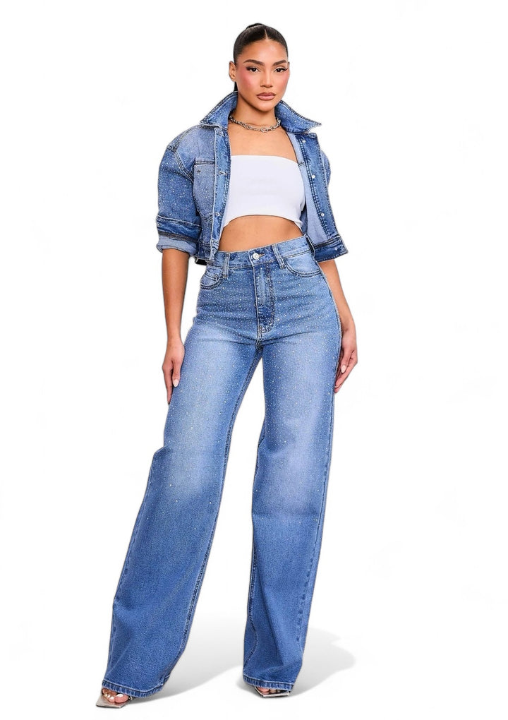 a woman in a white top and jeans