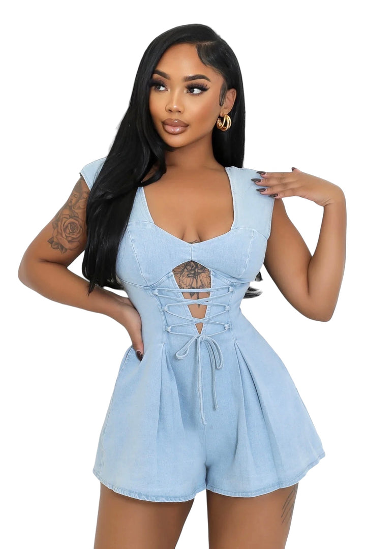 a woman wearing a blue rom with cut outs