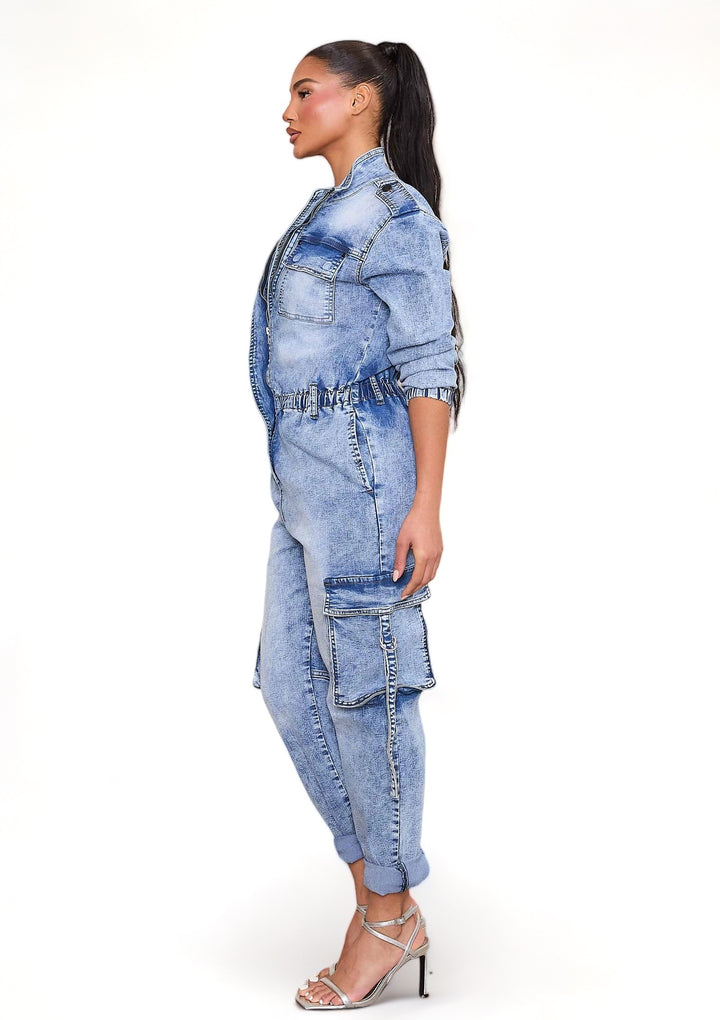 a woman wearing a denim jumpsuit and heels
