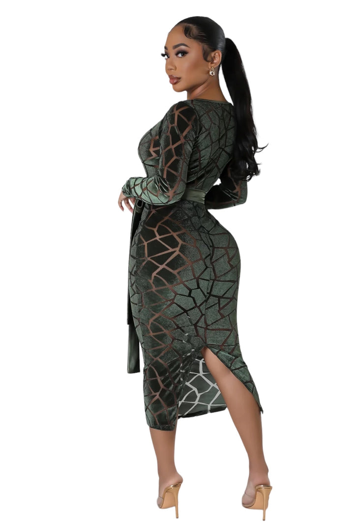a woman in a green dress with a high slit