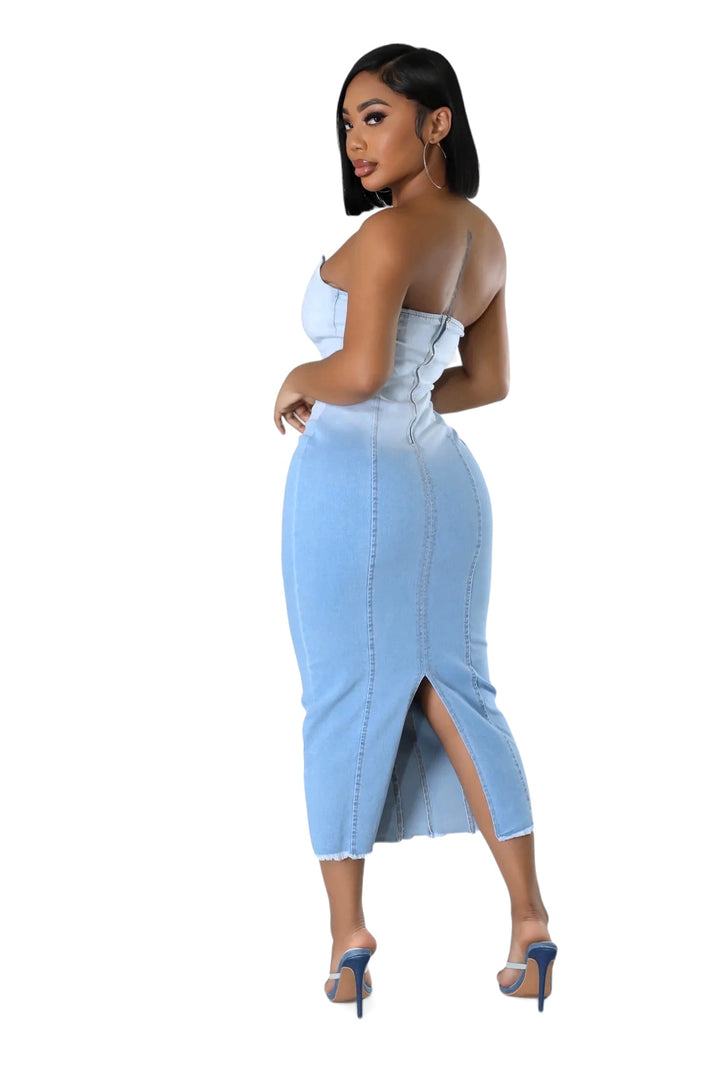 a woman in a light blue dress with a high slit