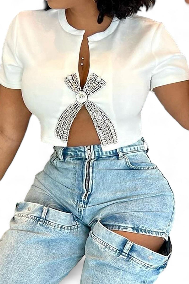 a woman wearing a white shirt and jeans
