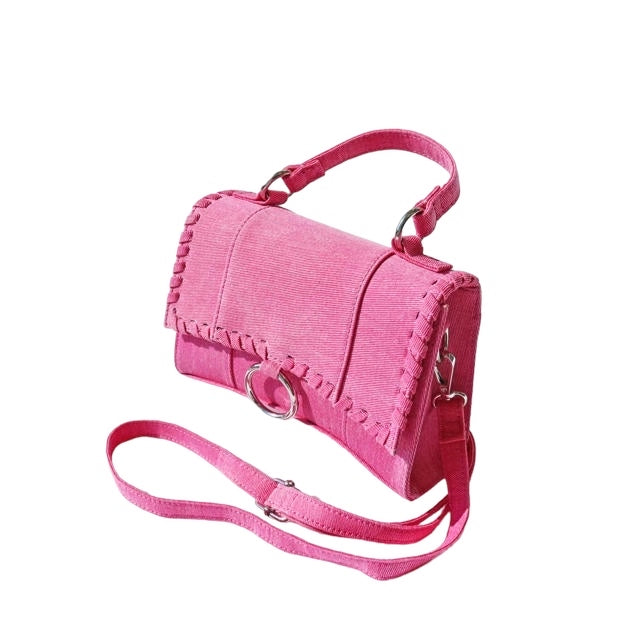 a pink handbag with a strap on a white background