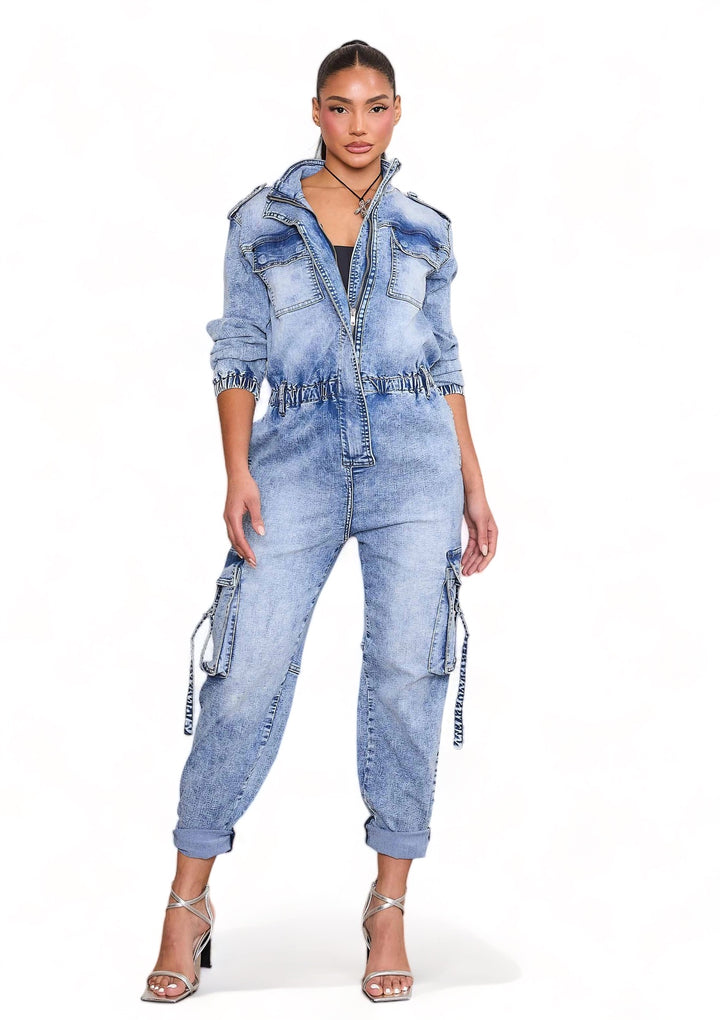 a woman wearing a denim jumpsuit and jacket