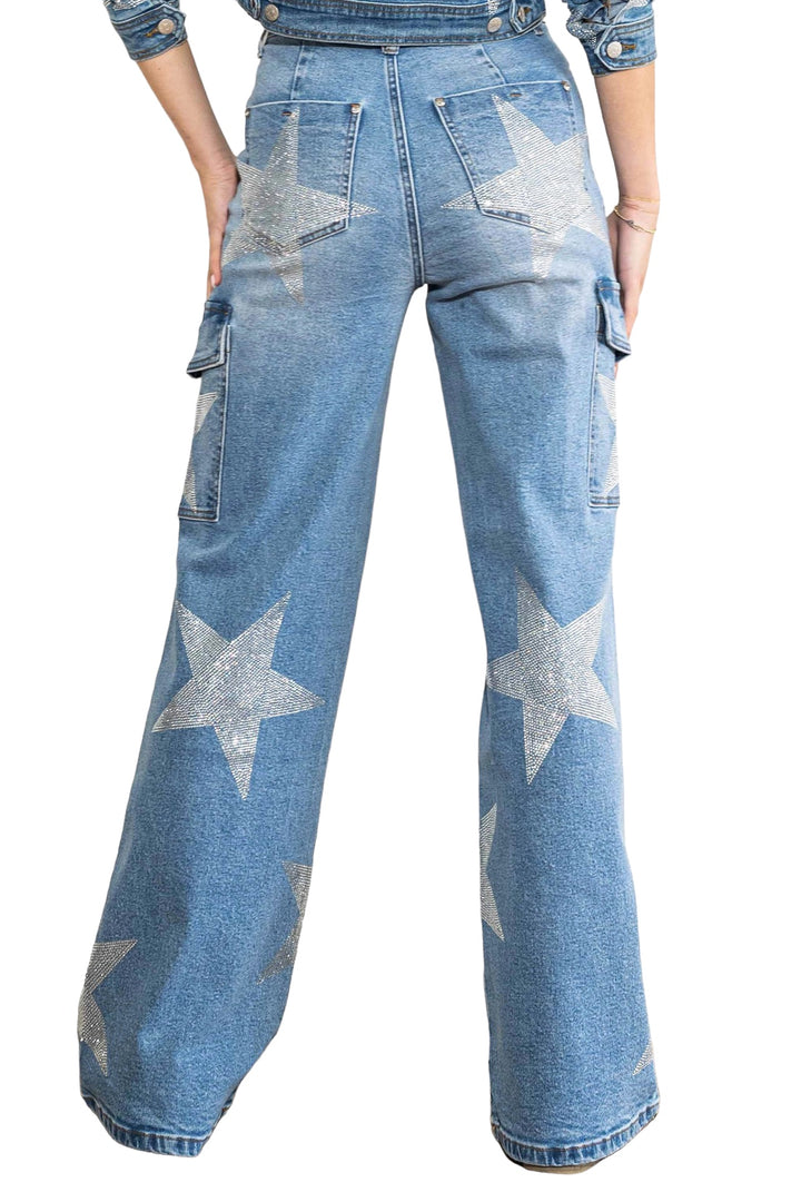 a woman wearing a pair of blue jeans with silver stars on them