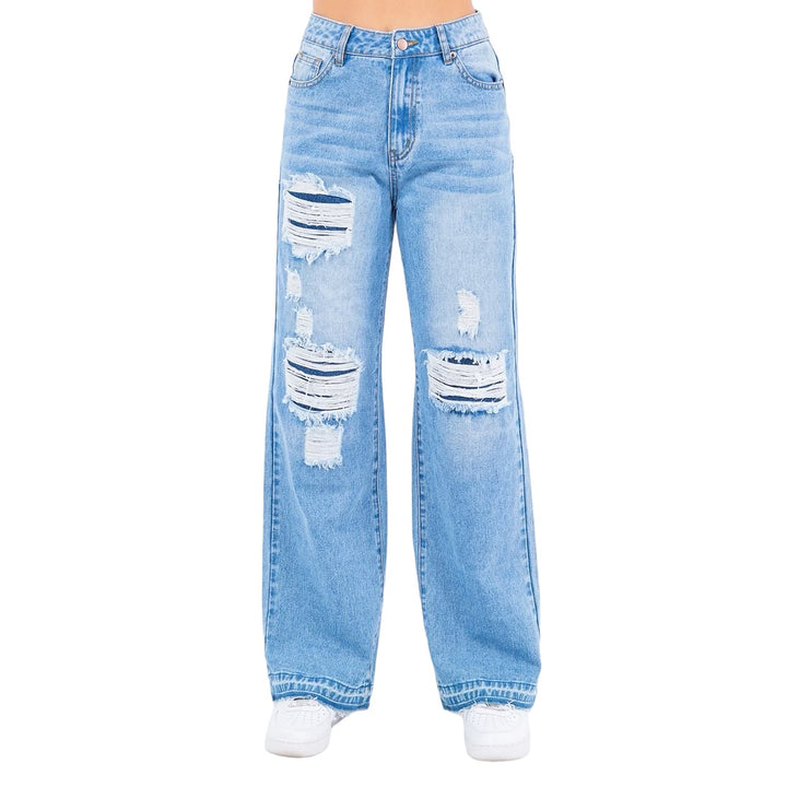 a woman is wearing a pair of ripped jeans