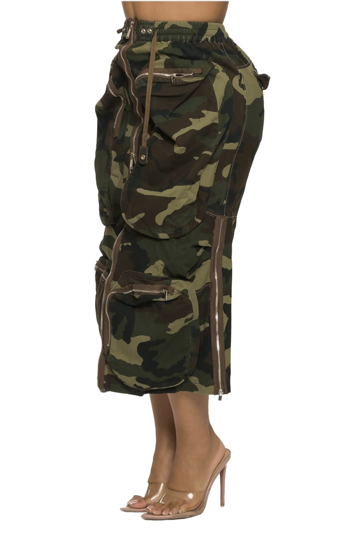 a woman wearing a camouflage skirt and heels