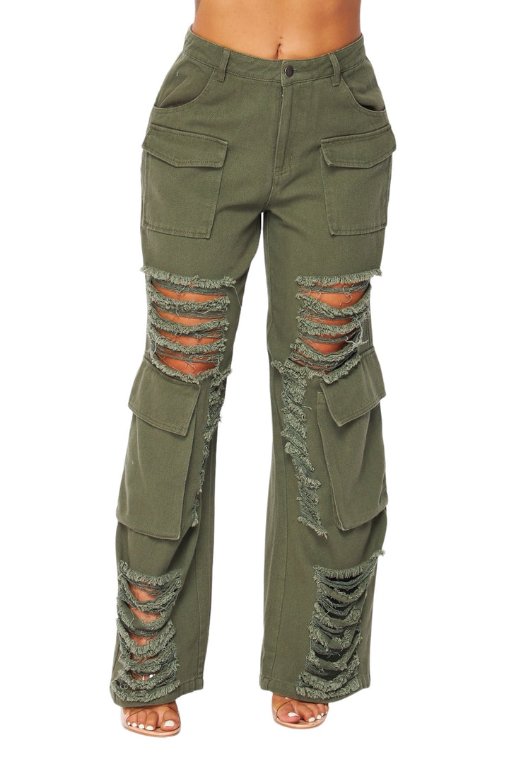 a woman in green pants with holes on the side