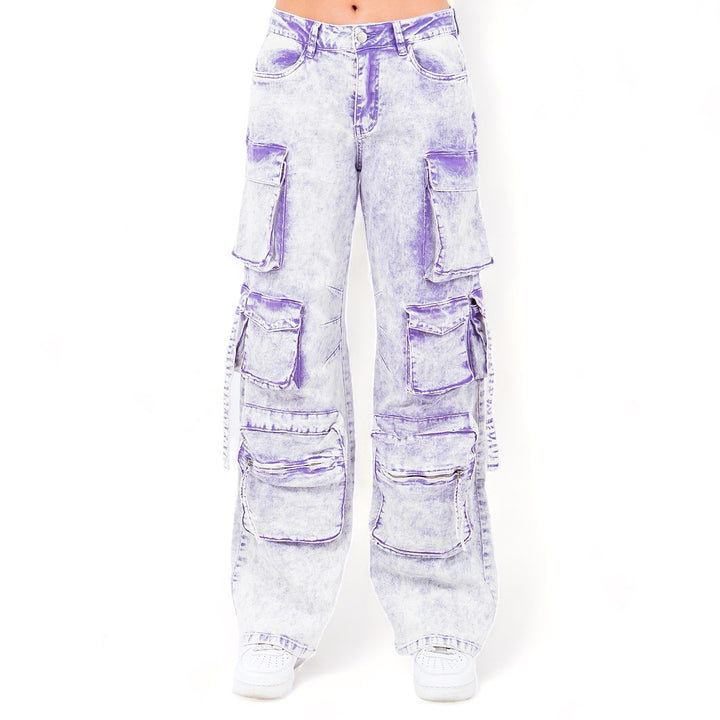 a woman wearing a pair of purple jeans