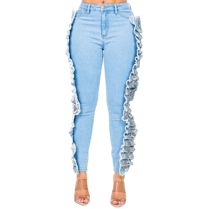 a woman wearing light blue jeans with ruffles on the side