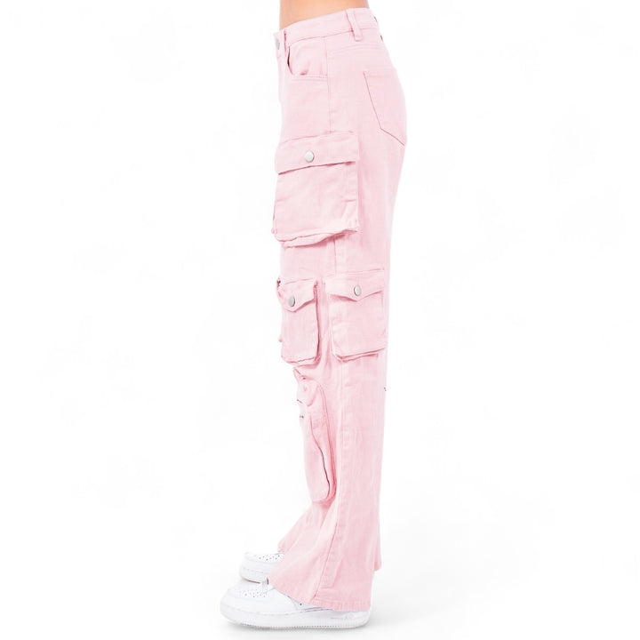 a woman wearing pink pants and white sneakers