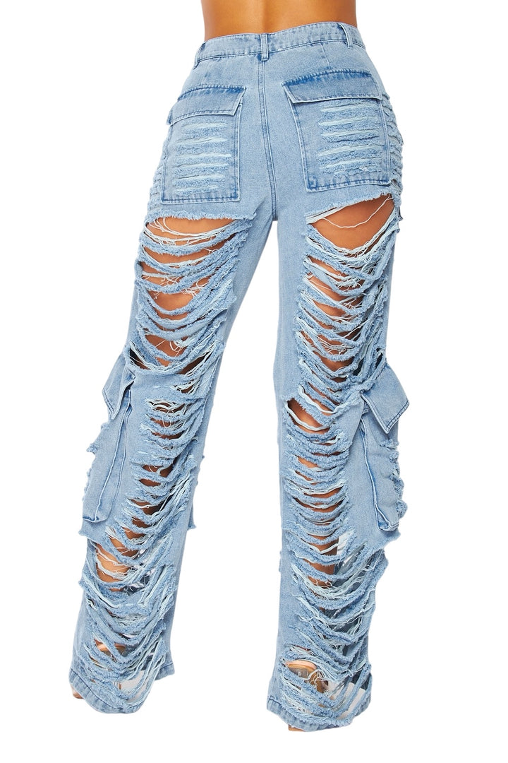 a woman wearing a pair of ripped jeans
