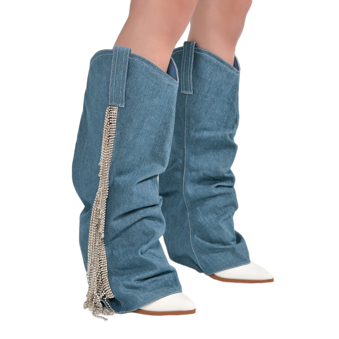 a close up of a pair of boots with tassels