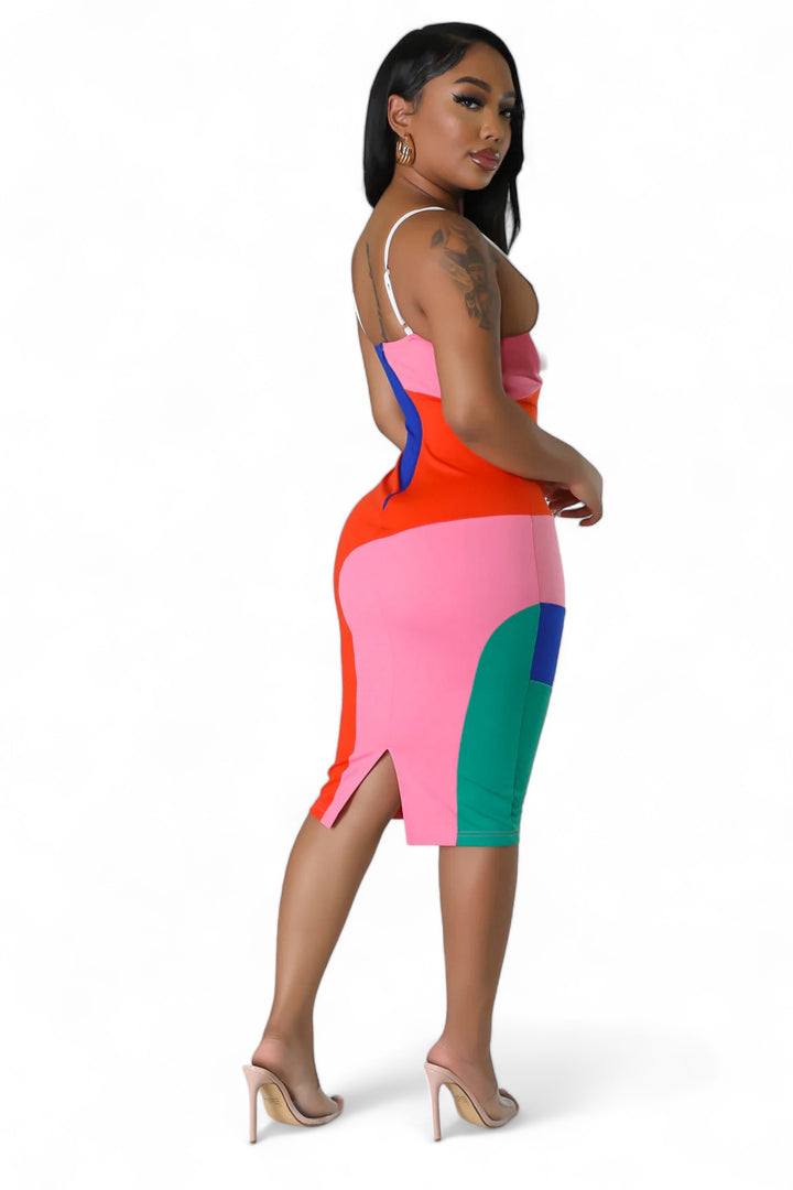 a woman in a colorful dress posing for a picture
