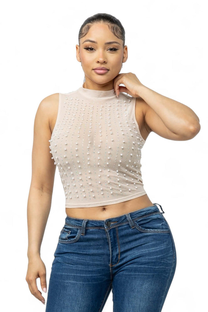 a woman wearing jeans and a crop top