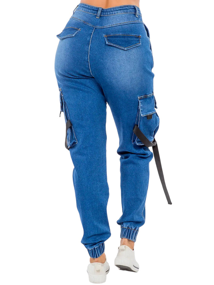 a woman wearing blue jeans and white sneakers