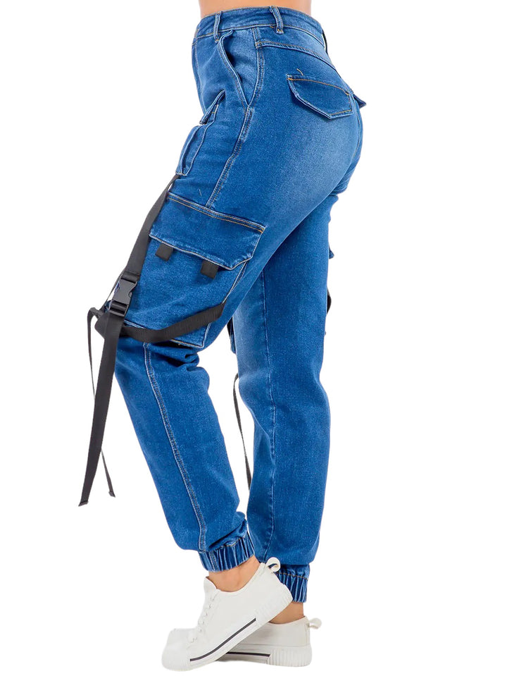 a woman wearing blue jeans and white sneakers