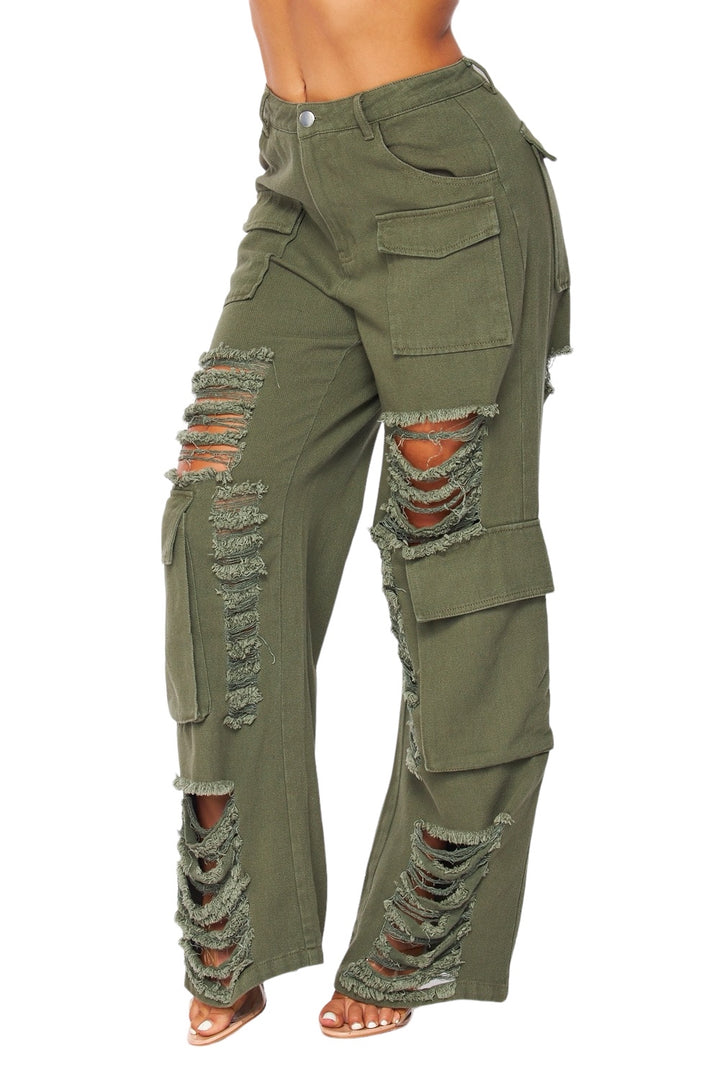 a woman in green pants with holes on the side