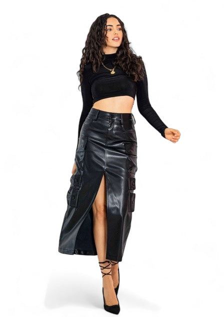 a woman in a black top and leather skirt