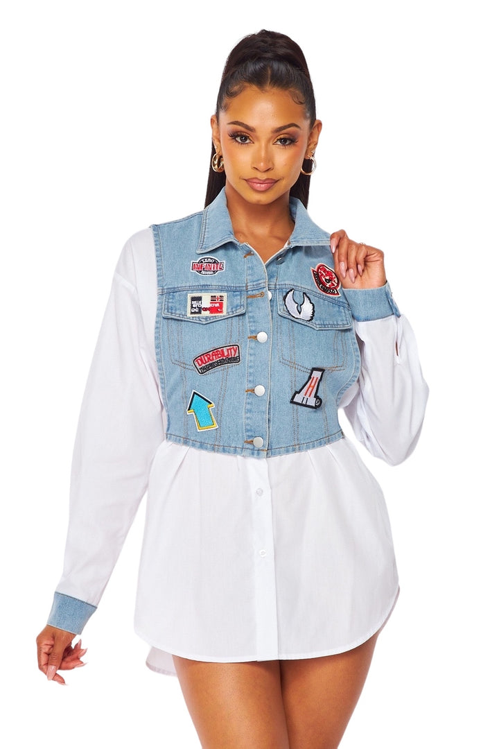 a woman wearing a jean jacket with patches on it