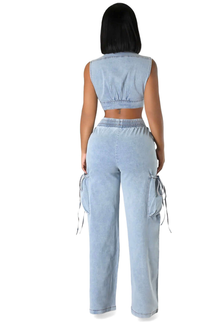 a woman wearing a crop top and pants