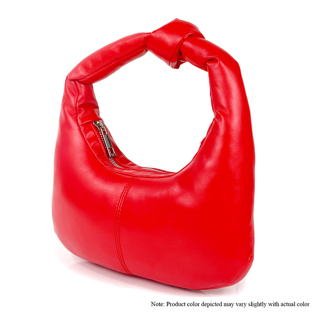 a red purse with a bow on the handle