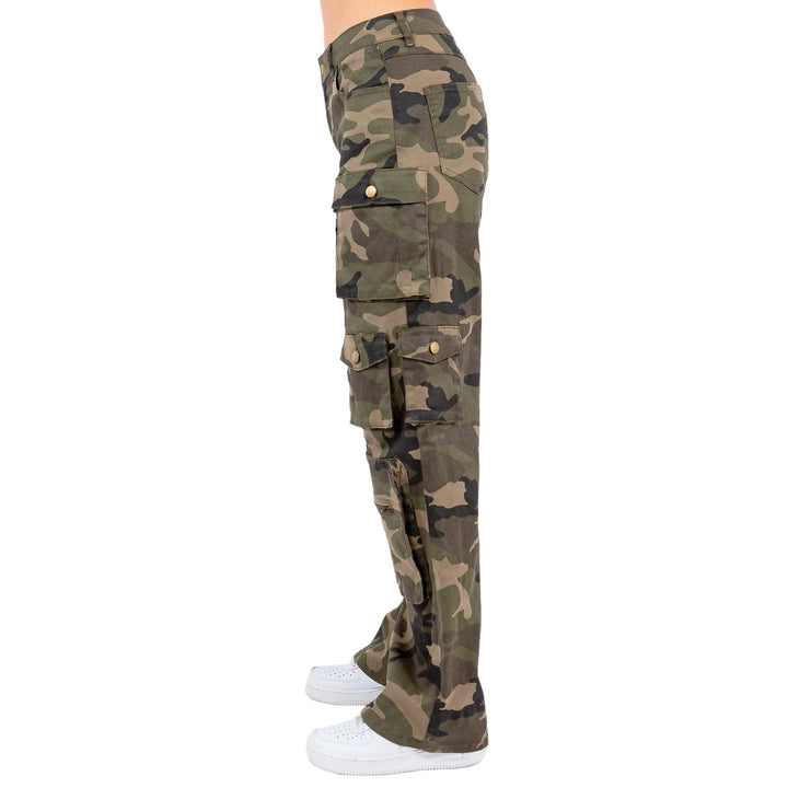 a woman wearing camouflage pants and white sneakers