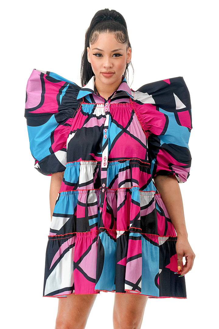 a woman in a colorful dress posing for a picture