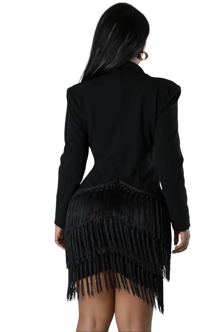 a woman wearing a black jacket with fringes